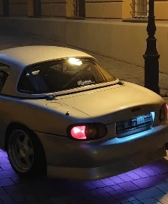 The MX-5's taillights at night